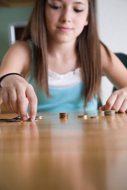 Staching Rular Girl 70+ Girl Stacking Coins Stock Photos, Pictures & Royalty-Free Images ...