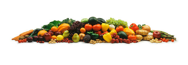 Mound of fruits and vegetable on a white background