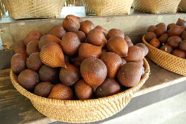 "Basket of snakefruit, also known as salak.  Commonly found in southeast Asia.  This photo was taken in central Bali, Indonesia."