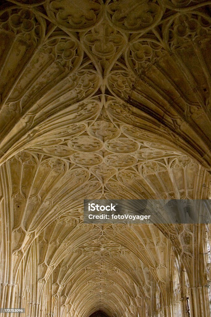 Cloistered corridor with fan vaulting Ornate fan vaulted ceiling soaring over corridor in ancient cloisters, made of honey coloured stone. Adobe RGB 1998 colour profile (colours will appear punchier in downloaded version). Ancient Stock Photo
