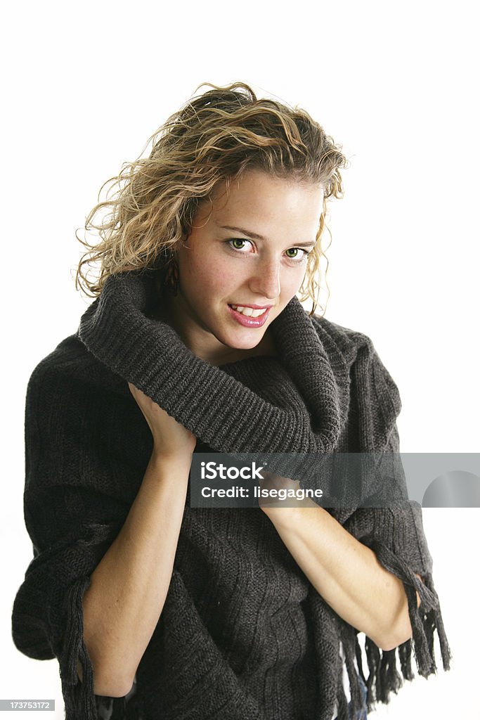 Woman wrapping in a shawl Young woman wearing a shawl. Adult Stock Photo