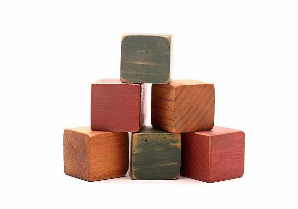 Wooden blocks, wooden toys, space for letters with hand isolated on white background.