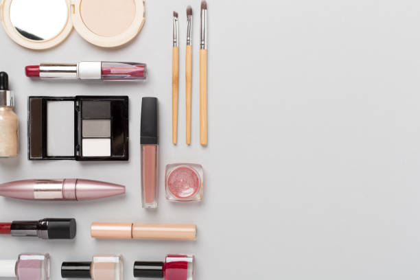 istock Flat lay with makeup products and tools on color background 1737534363