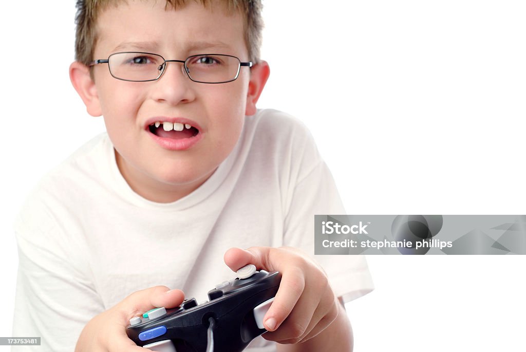 Young Boy spielen eines Videospiels mit verwirrtem Look - Lizenzfrei Freizeitspiel Stock-Foto