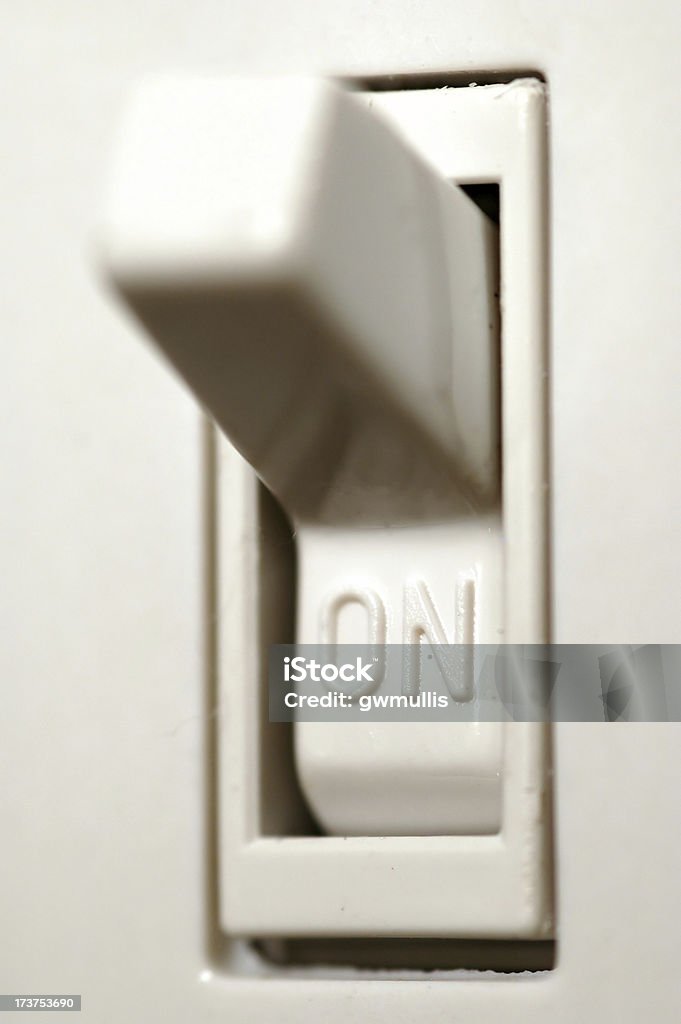 I'm turned on A narrow depth of field macro of a light switch in the on position. Throwing Stock Photo