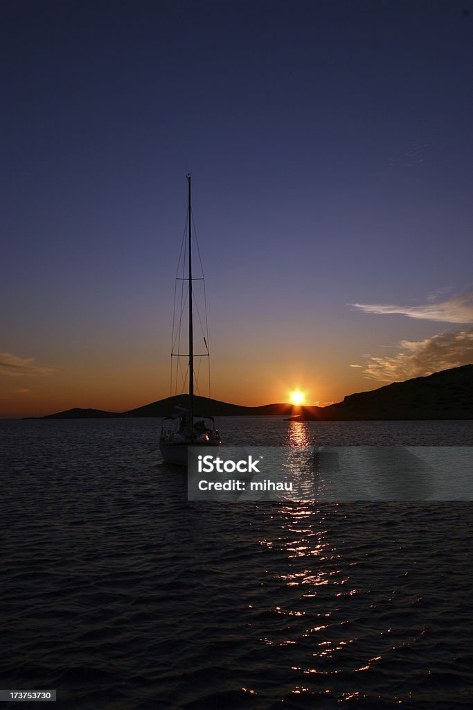 Sailboat "A sailboat at sunet. Taken at the Kornati national park, Croatia." Adult Stock Photo