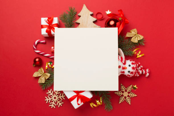 istock Greeting card mockup with christmas decor on color background, top view 1737537592