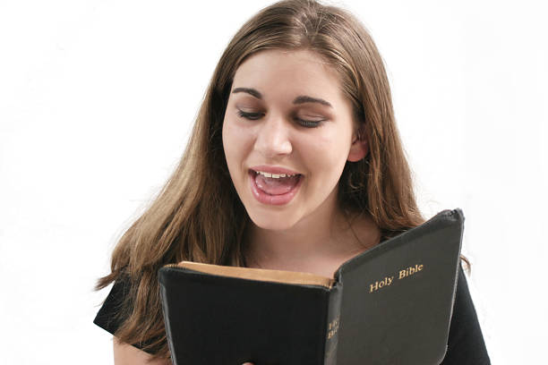 hallelujah teen happy young woman with a bible sing praise stock pictures, royalty-free photos & images