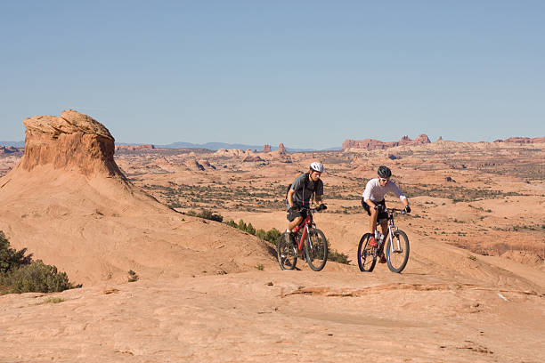 istock Two mountain bikers on slickrock trail. 173754481