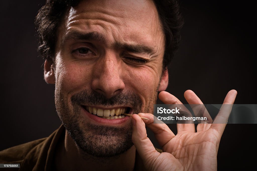 Man with toothpick in mouth Toothpick Stock Photo