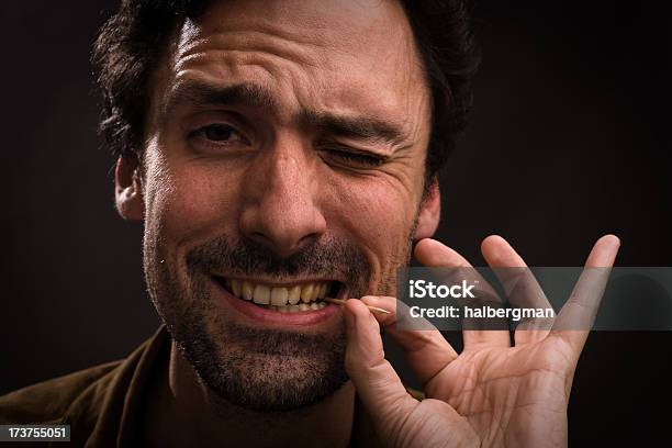 Man With Toothpick In Mouth Stock Photo - Download Image Now - Toothpick, Men, Winking