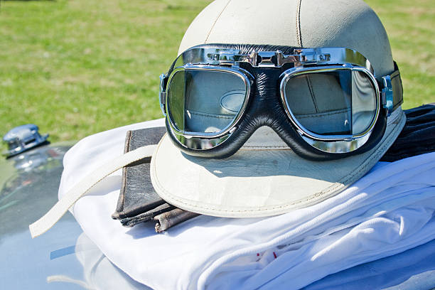 Driving suit and helmet on bonnet stock photo