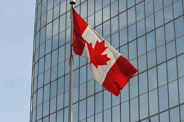 istock Canadian flag in front of skyscraper, Toronto 173755530