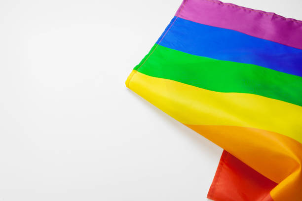 bandera gay arcoíris sobre fondo blanco de cerca - supreme court fotografías e imágenes de stock
