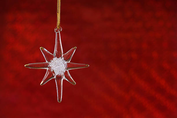 istock Crystal christmas star over a red backdrop 173757048