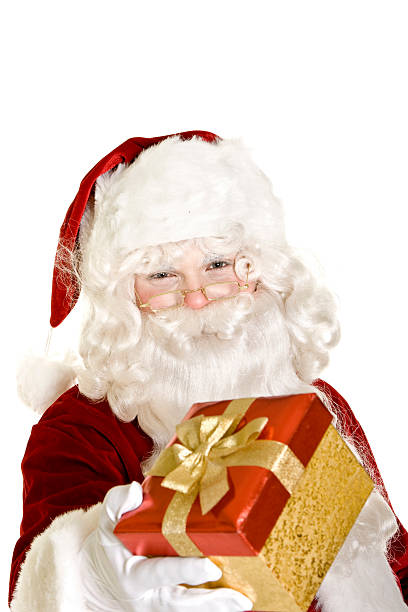 istock Santa giving a gift isolated on white 173757316