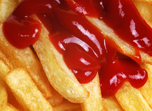 Potato chips with ketchup.