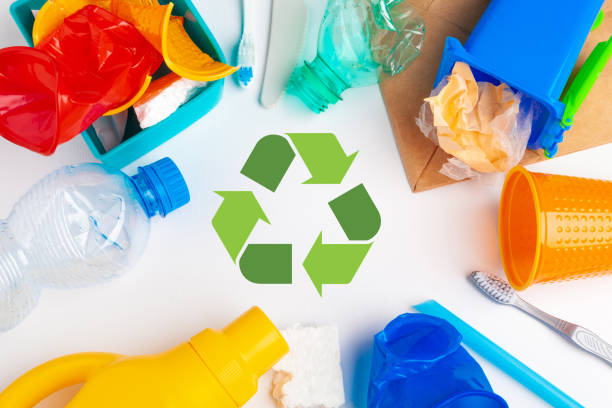 istock waste recycling eco symbol with garbage disposal on table background top 1737579776