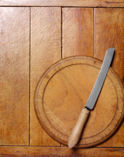 Bread Knife and Bread Board on a Chopping Board