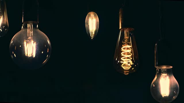 Dusty retro light bulbs. turn on and off. Scary, mysterious. Halloween