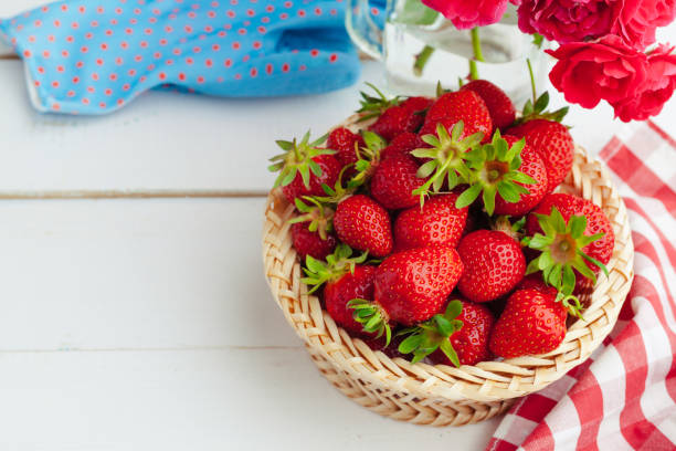 istock Fresh strawberry in basket on wooden background 1737584589