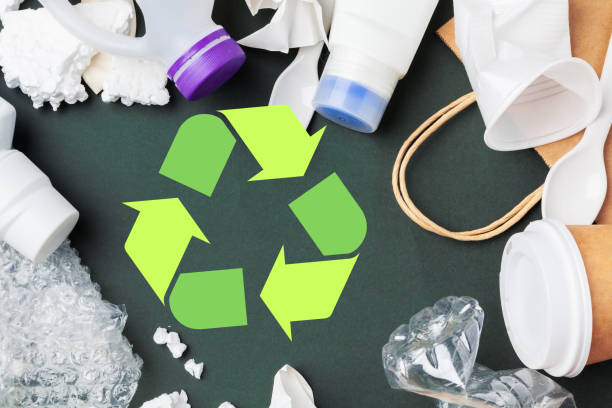 istock Eco concept with recycling symbol on table background top view 1737585119
