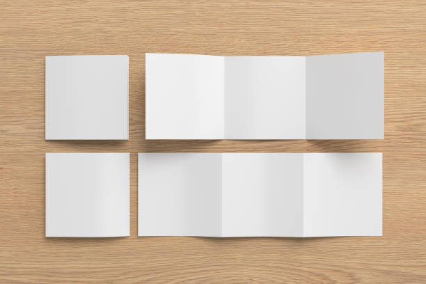 istock Square trifold roll brochure booklet mockup on wooden background 1737588881