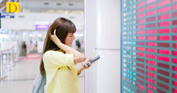 istock woman anxious exchange rate airport 1737591128