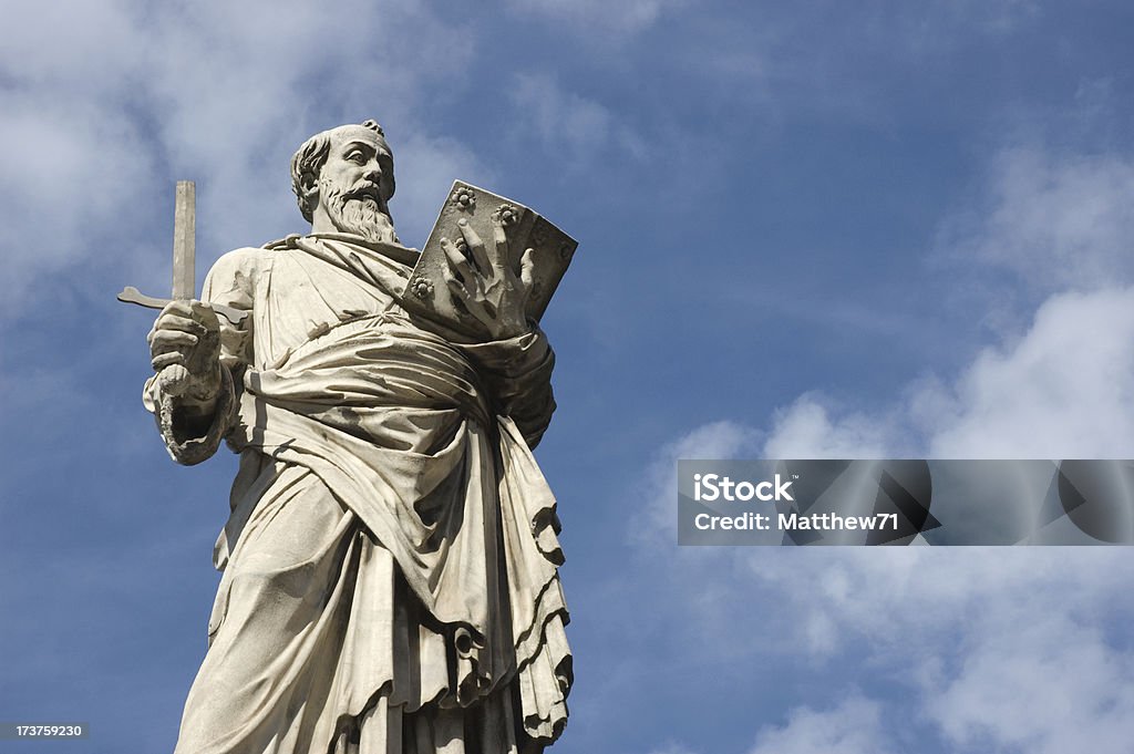 St Paul Bernini statue of St Paul in the entrance of Ponte San Angelo in Rome against blue sky. Sword Stock Photo
