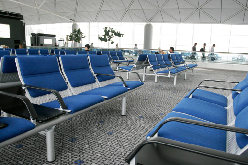 airport waiting area with people at backgroundRelated images: