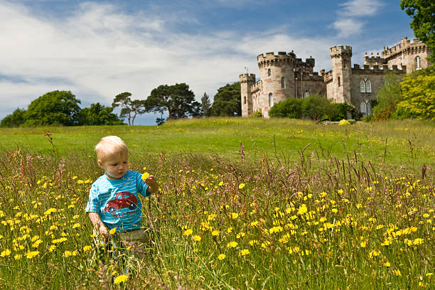 istock Young child and Old castle with flowers 173760568