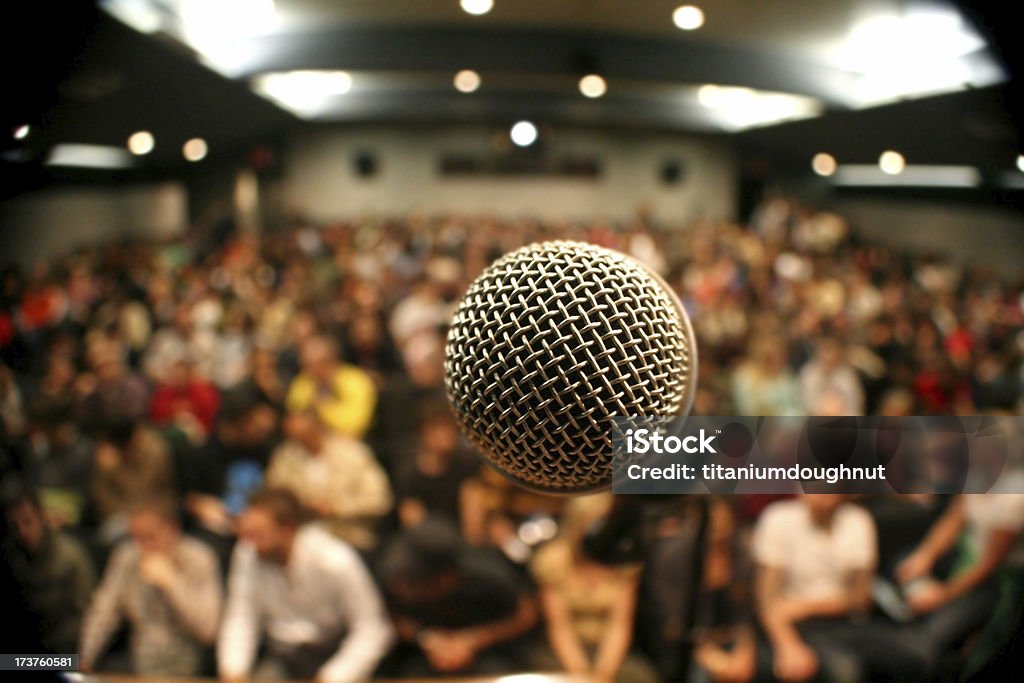 Microphone with crowd A mic in front of a packed theater. Microphone Stock Photo Microphone with crowd A mic in front of a packed theater. Microphone Stock Photo