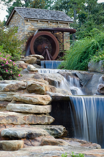Water Wheel Mill on Bounding  Creek in Landscaping with copy-space.