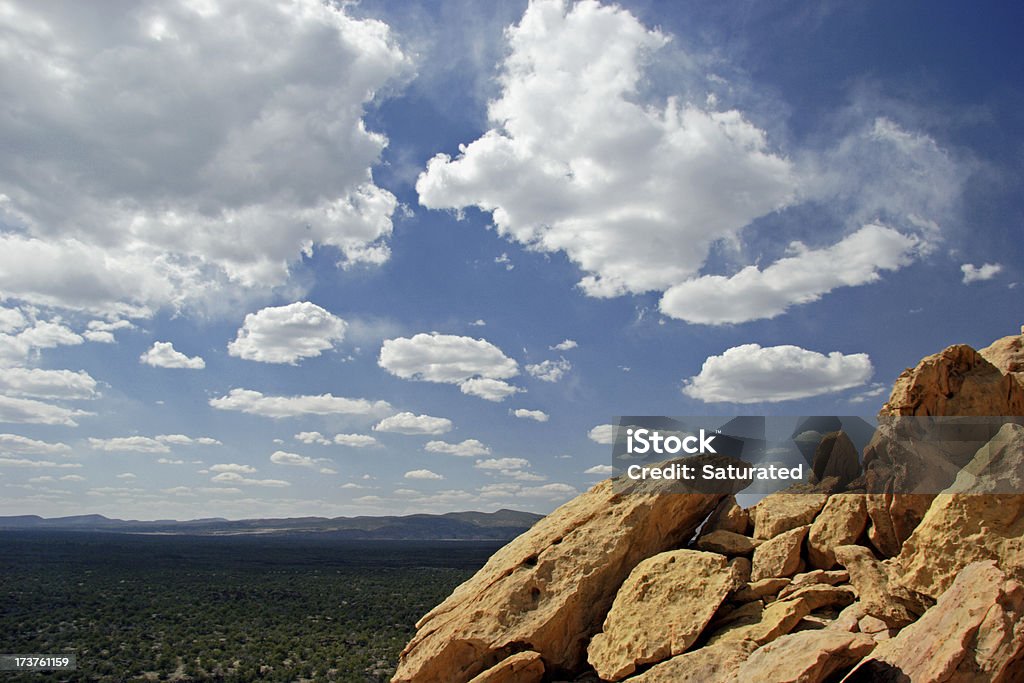 Sky, Clouds and Rocks - El Malpais National Monument "Golden rocks against a blue sky filled with puffy clouds. El Malpais National Monument, New Mexico." Beauty In Nature Stock Photo