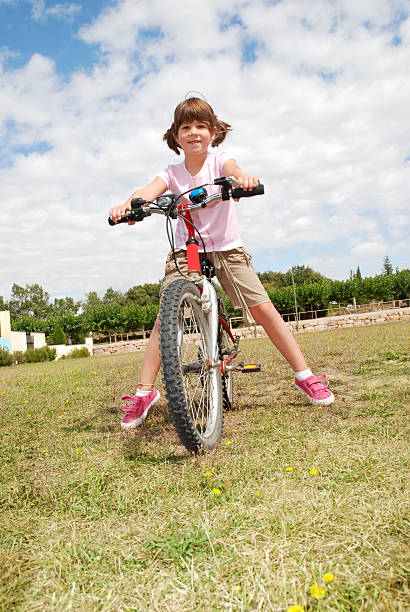 istock Little girl with bike 173761849