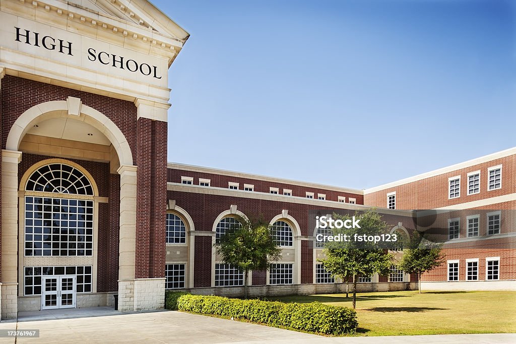 Education:  High school building entrance.  Copyspace and sky. Back to School:  High school building entrance.  Copyspace and sky.  SEE MORE LIKE THIS... Similar images in lightboxes below.  School Building Stock Photo