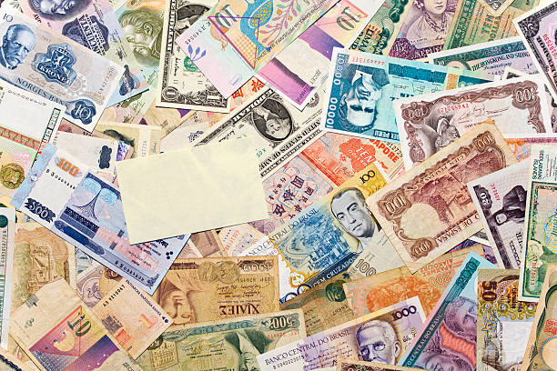 istock Yellow post it on currency from all over the world. 173762791