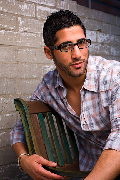 istock Male Headshot, Sitting Relaxed by Brick Wall 173762945