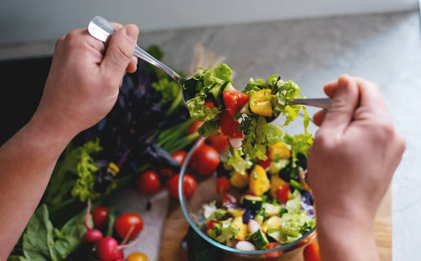 istock preparing healthy salad in kitchen 1737634402