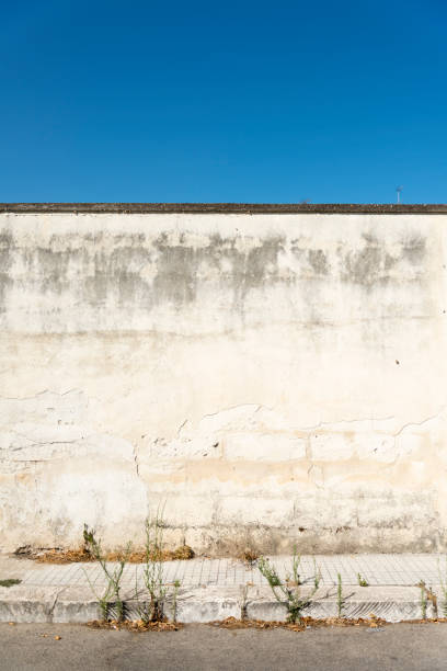 istock Old concrete grunge wall with sidewalk 173764195