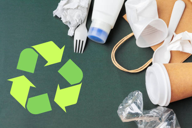 istock Eco concept with recycling symbol on table background top view 1737647794