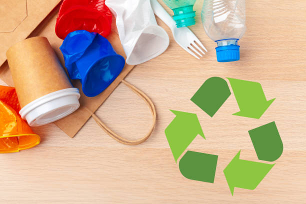 istock Eco concept with recycling symbol on table background top view 1737648919