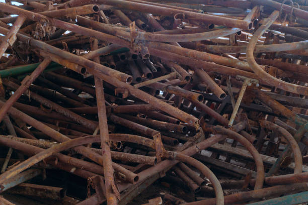istock Pile of rusty scrap metal pipes close up 1737678278