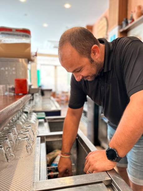 istock Waiter working in a rural town bar 1737679865