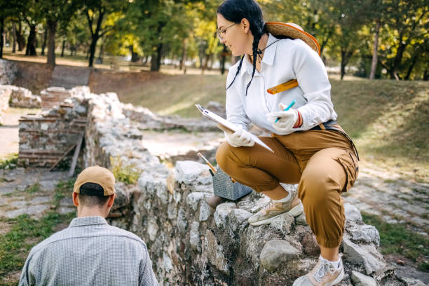 istock Young archeologist working on the field together 1737694494