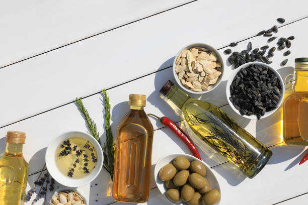 istock Different cooking oils and ingredients on white wooden table, flat lay. Space for text 1737695652