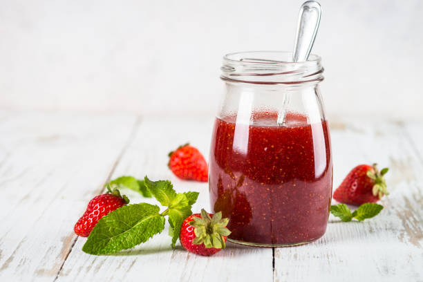 istock Strawberry jam in the glass jar. 1737695680