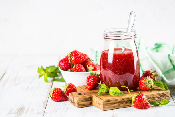 istock Strawberry jam in the glass jar. 1737696212