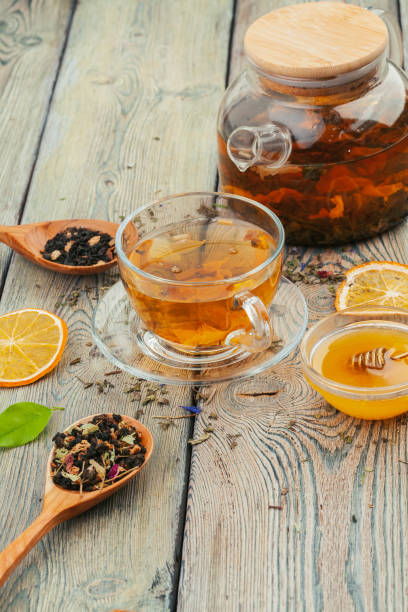 istock Cup of tea and tea leaves on wooden table 1737696813