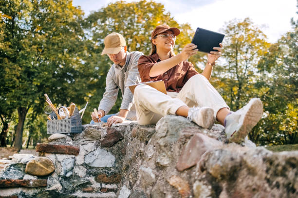 istock Young archeologist working on the field together 1737698389